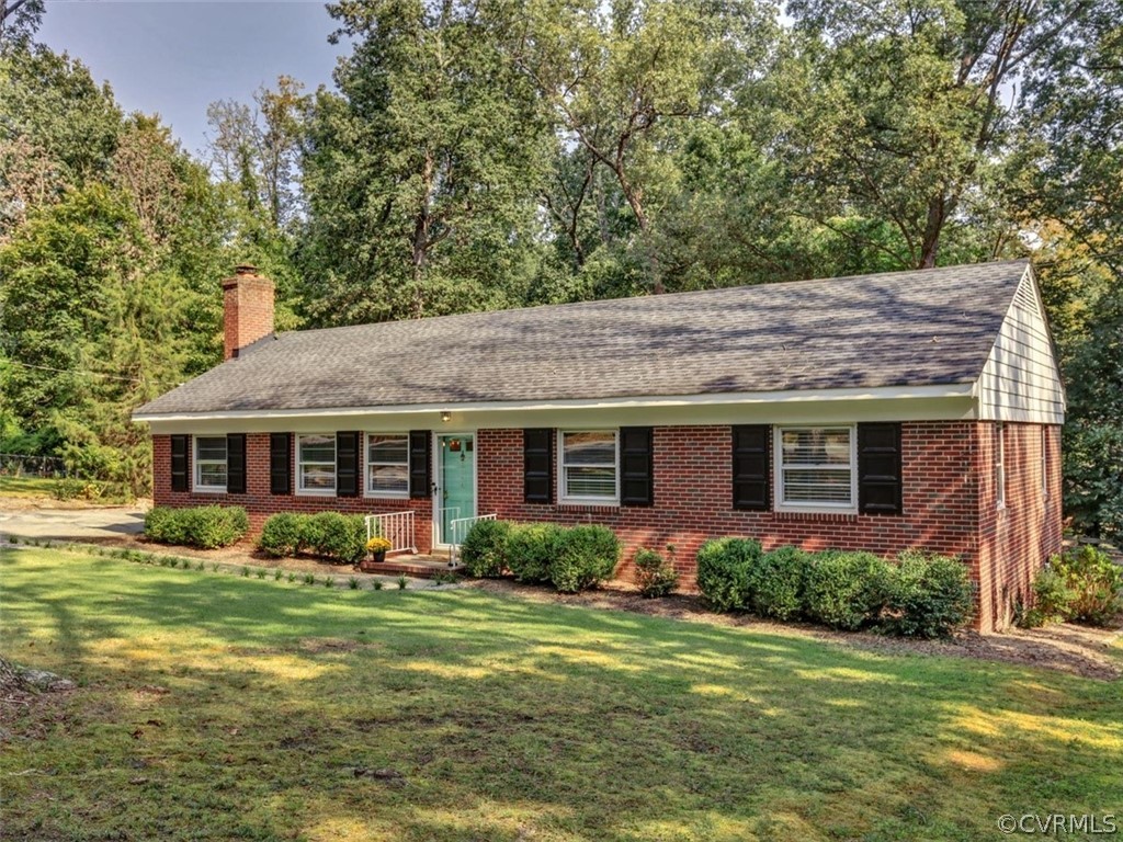 8166 Brown Road Richmond, VA 23235 - Photo 3 of 27 a view of a house with a garden