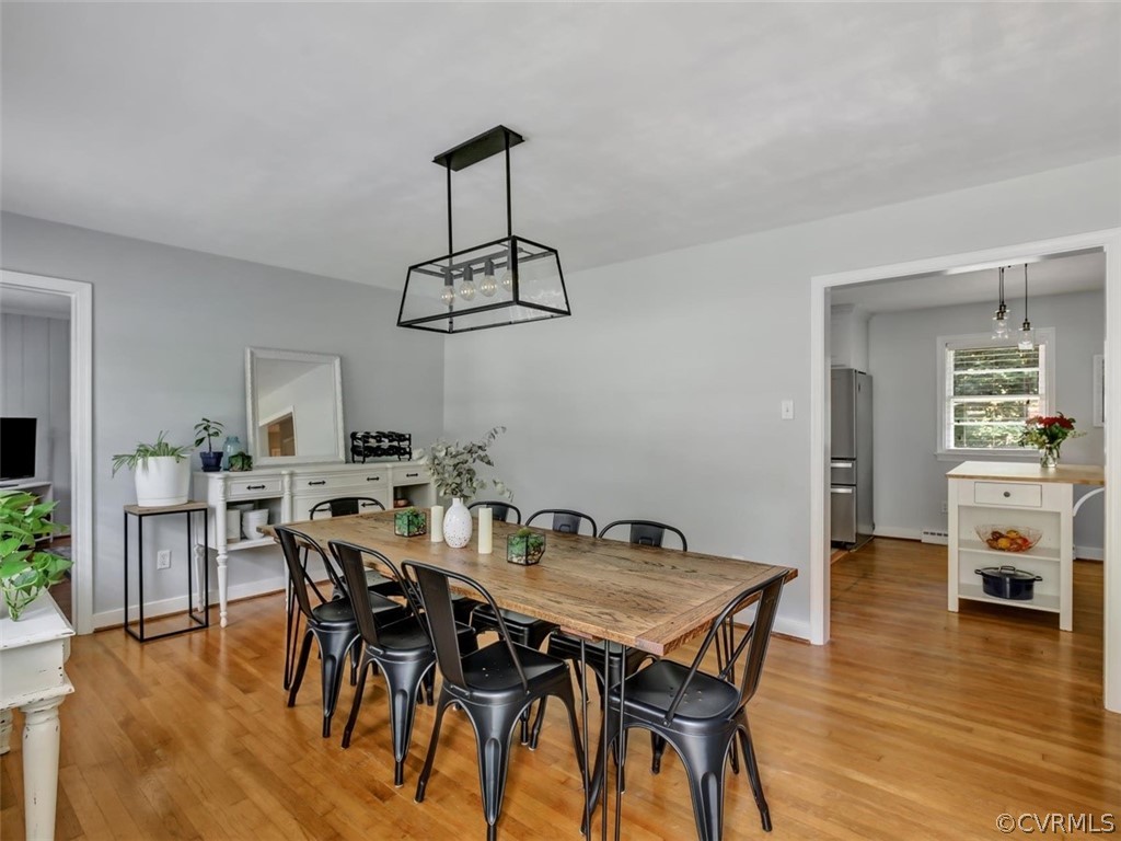 8166 Brown Road Richmond, VA 23235 - Photo 4 of 27 a view of a dining room with furniture wooden floor and chandelier