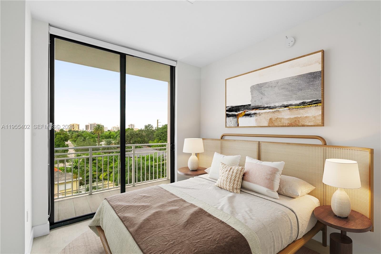 1601 Southwest 32nd Avenue, Unit 513 Miami, FL 33145 - Photo 4 of 6 a bedroom with a large window and a bed