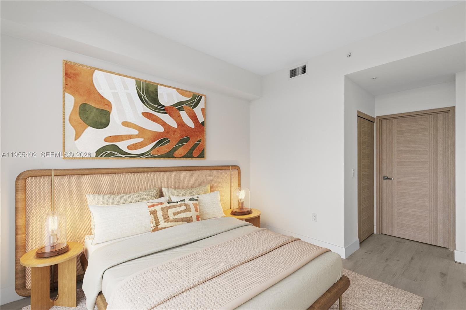 1601 Southwest 32nd Avenue, Unit 513 Miami, FL 33145 - Photo 5 of 6 a bedroom with a bed and painting on the wall