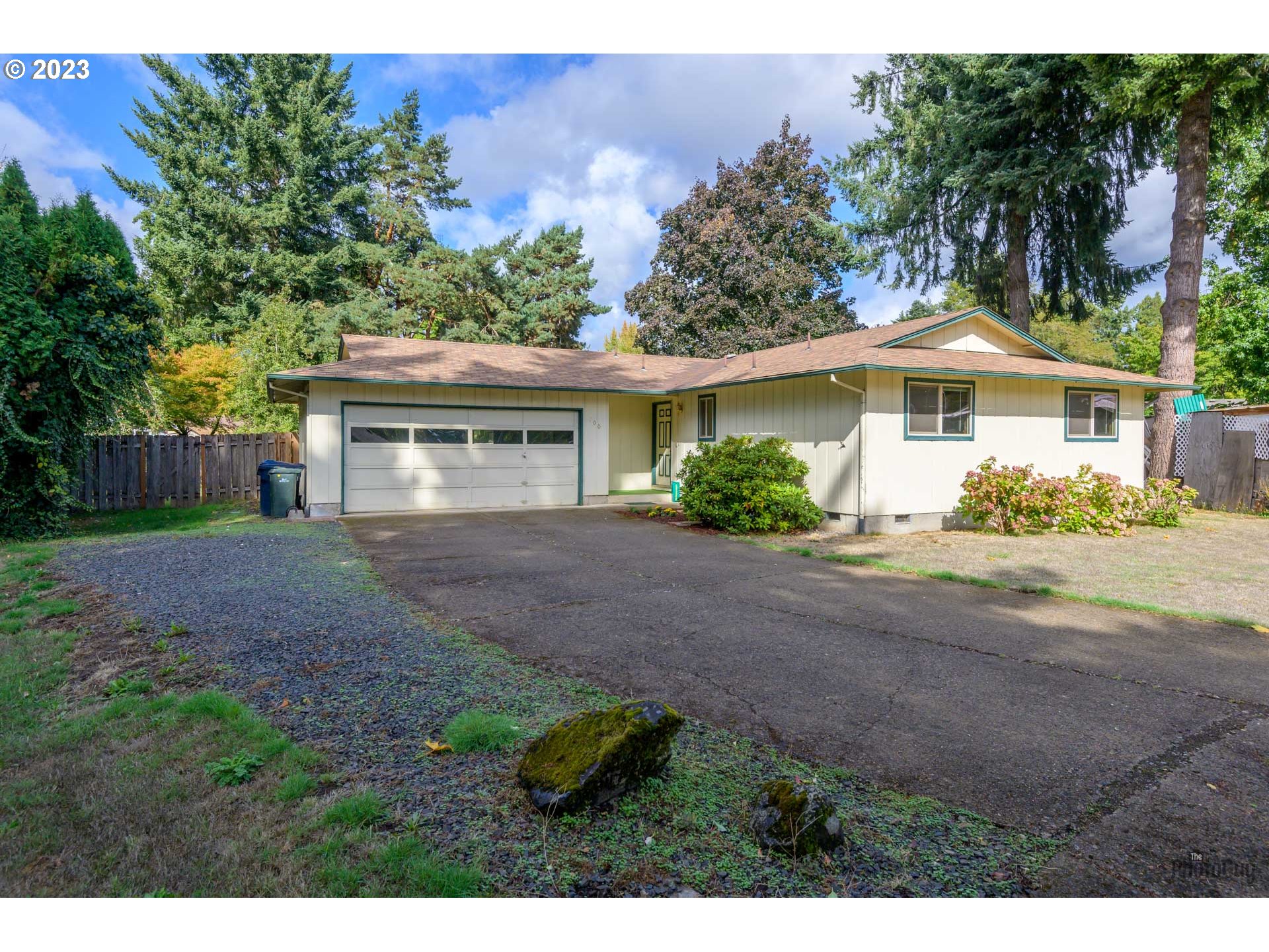 700 64th Street Springfield, OR 97478 - Photo 3 of 28 a front view of a house with garden