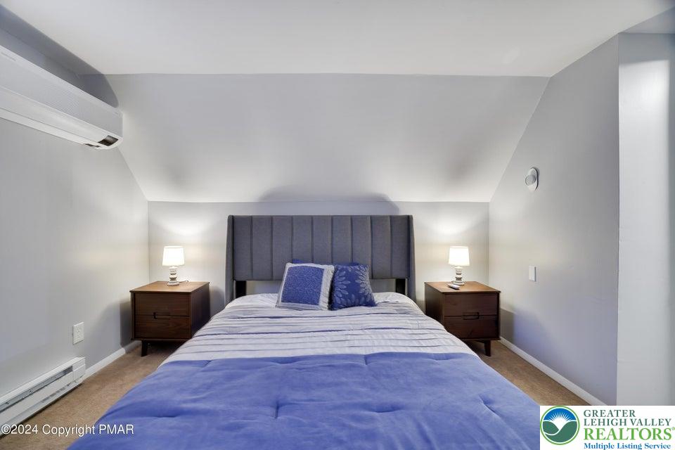 3176 Cherry Ridge Road Bushkill, PA 18324 - Photo 25 of 37 a bedroom with a bed and window