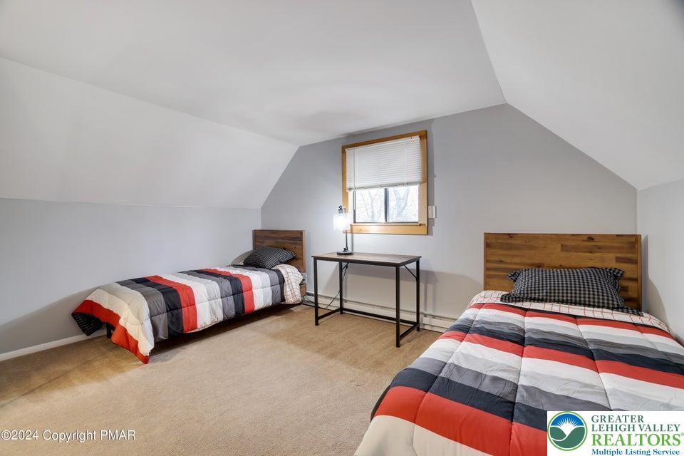 3176 Cherry Ridge Road Bushkill, PA 18324 - Photo 26 of 37 a bedroom with a bed and window