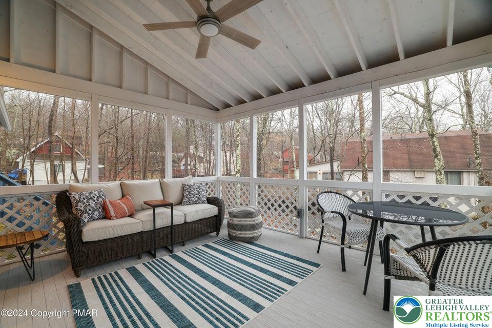3176 Cherry Ridge Road Bushkill, PA 18324 - Photo 33 of 37 a living room with furniture and a large window