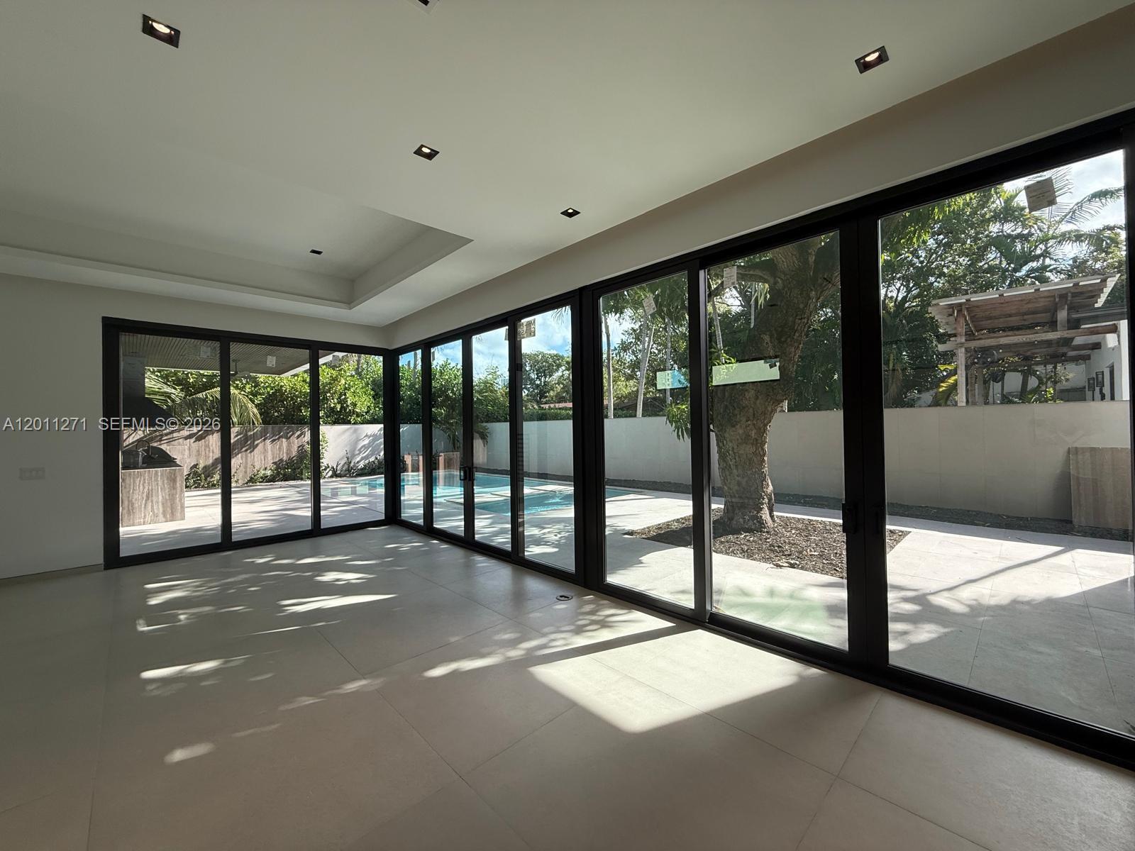 125 Southwest 29th Road Miami, FL 33129 - Photo 12 of 45 a view of a big room with large windows and city view