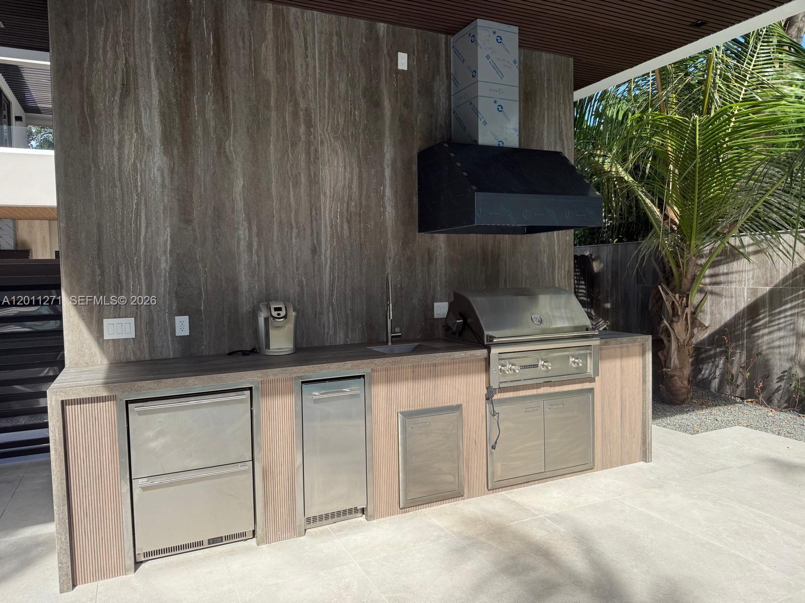 125 Southwest 29th Road Miami, FL 33129 - Photo 16 of 45 a kitchen with a cabinets and a stove
