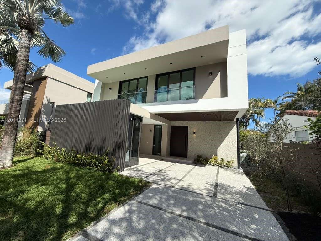 125 Southwest 29th Road Miami, FL 33129 - Photo 2 of 45 a front view of a house with a garden