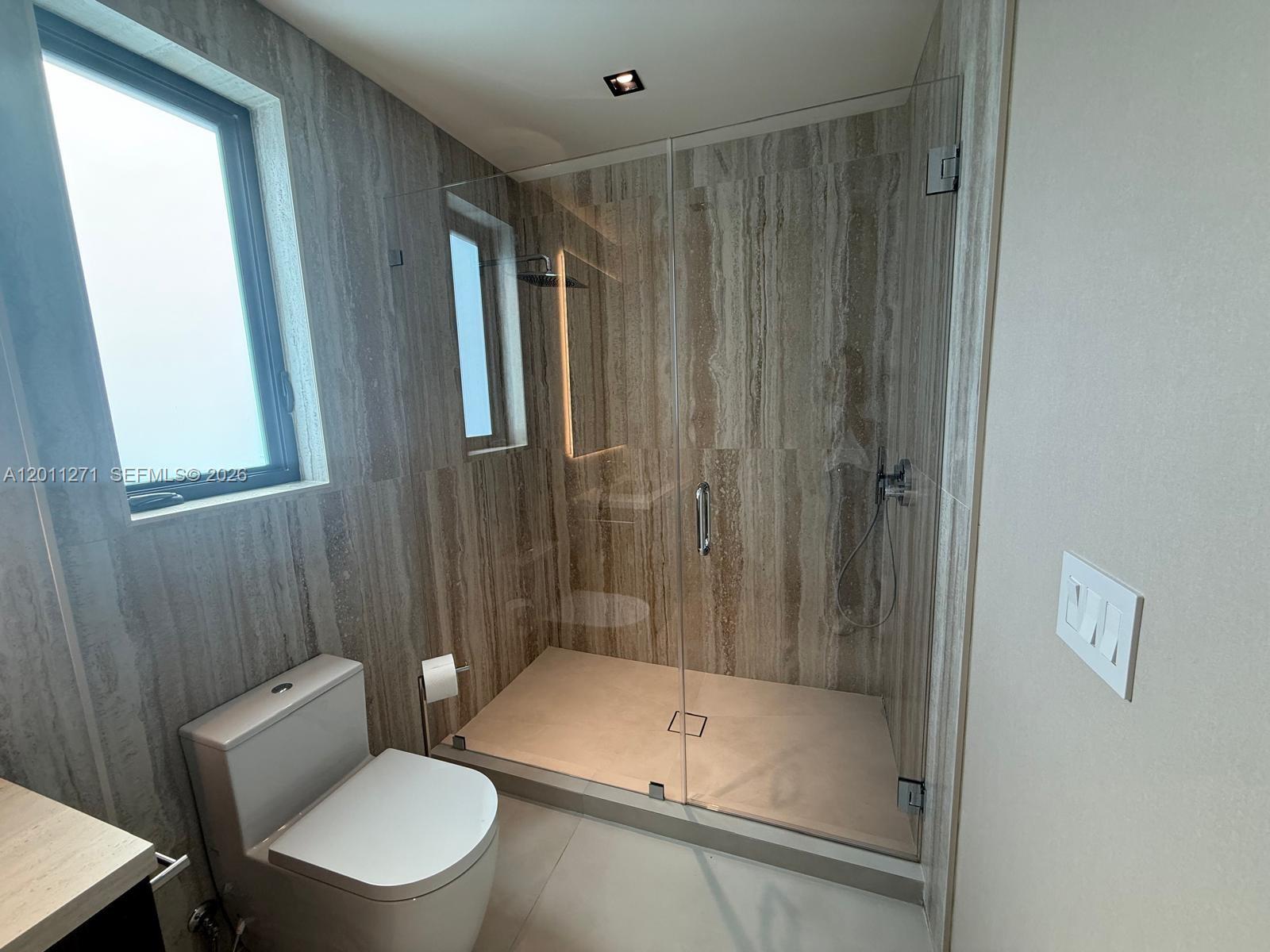 125 Southwest 29th Road Miami, FL 33129 - Photo 35 of 45 a bathroom with a toilet and shower