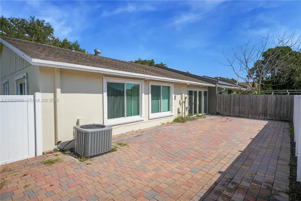 a kitchen with stainless steel appliances granite countertop a stove microwave and refrigerator