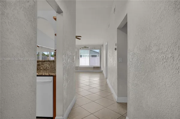 a kitchen with stainless steel appliances granite countertop a refrigerator stove and oven