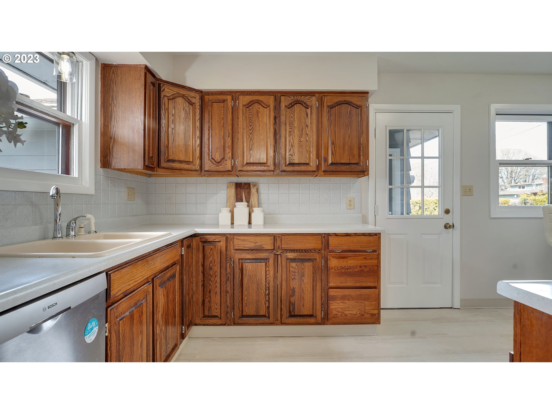 163 Northwest Reed Lane Dallas, OR 97338 - Photo 11 of 30 a kitchen with a sink cabinets and window