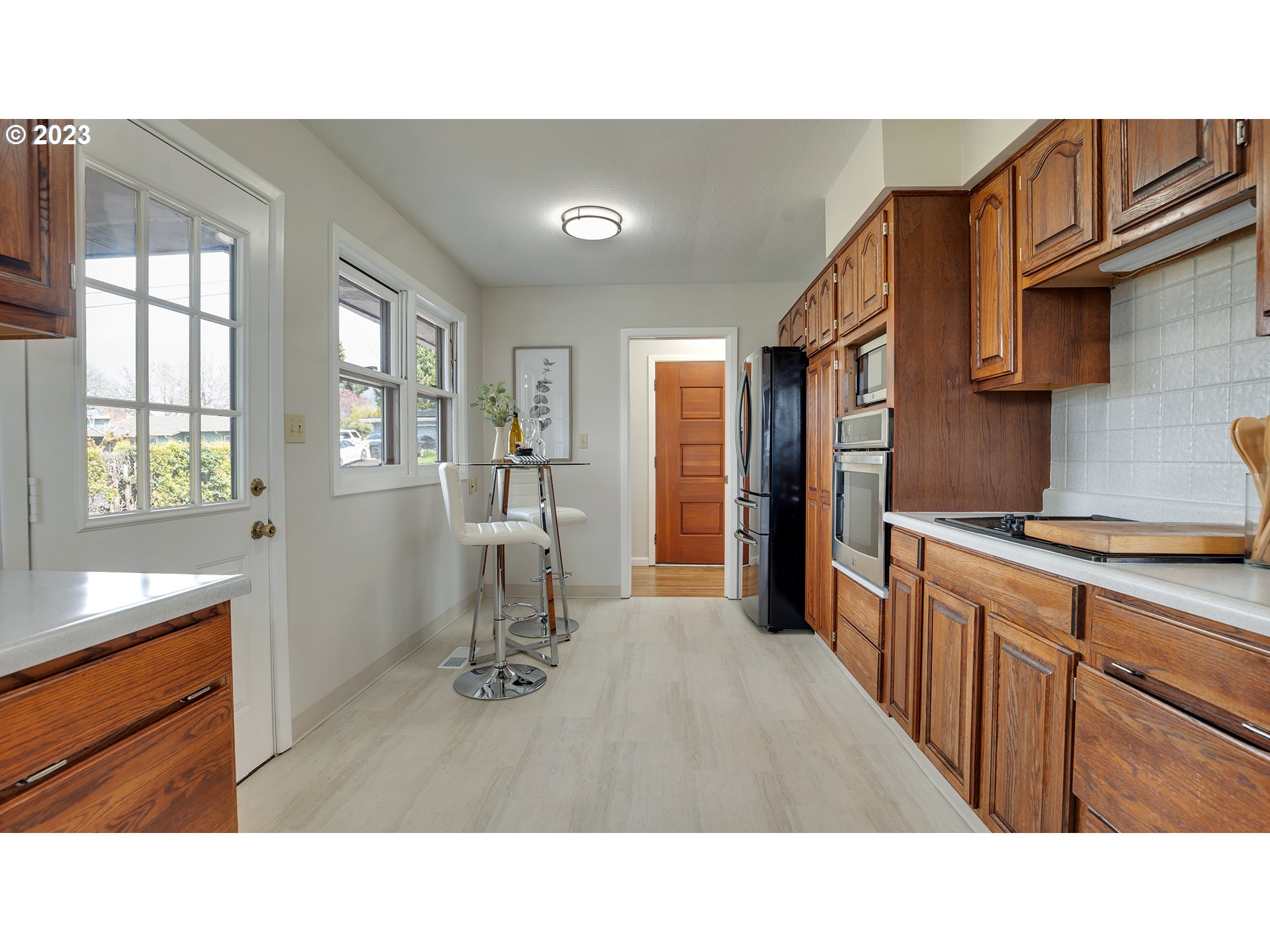 163 Northwest Reed Lane Dallas, OR 97338 - Photo 12 of 30 a open kitchen with sink and refrigerator