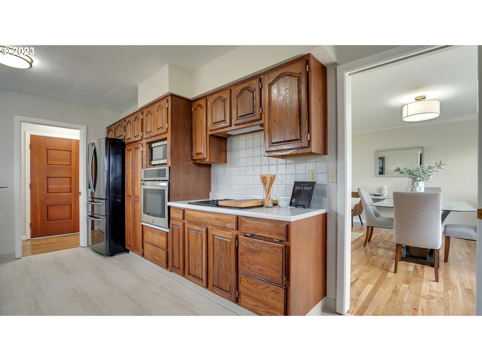 163 Northwest Reed Lane Dallas, OR 97338 - Photo 13 of 30 a kitchen with stainless steel appliances kitchen island granite countertop a sink and cabinets