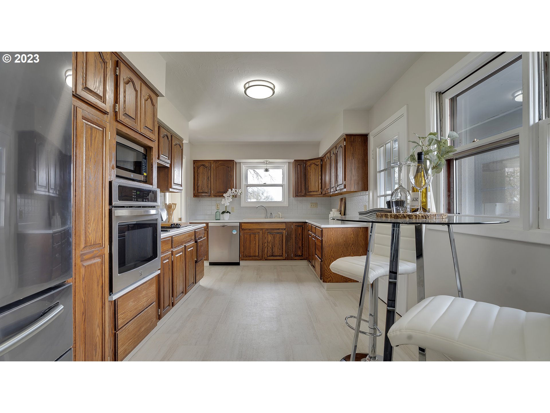 163 Northwest Reed Lane Dallas, OR 97338 - Photo 16 of 30 a kitchen with a refrigerator and a sink