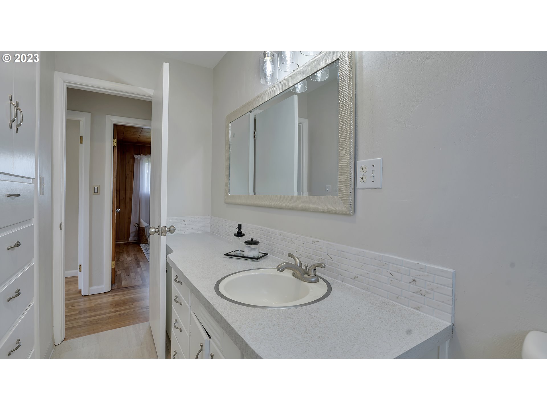 163 Northwest Reed Lane Dallas, OR 97338 - Photo 18 of 30 a bathroom with a sink vanity granite and a mirror