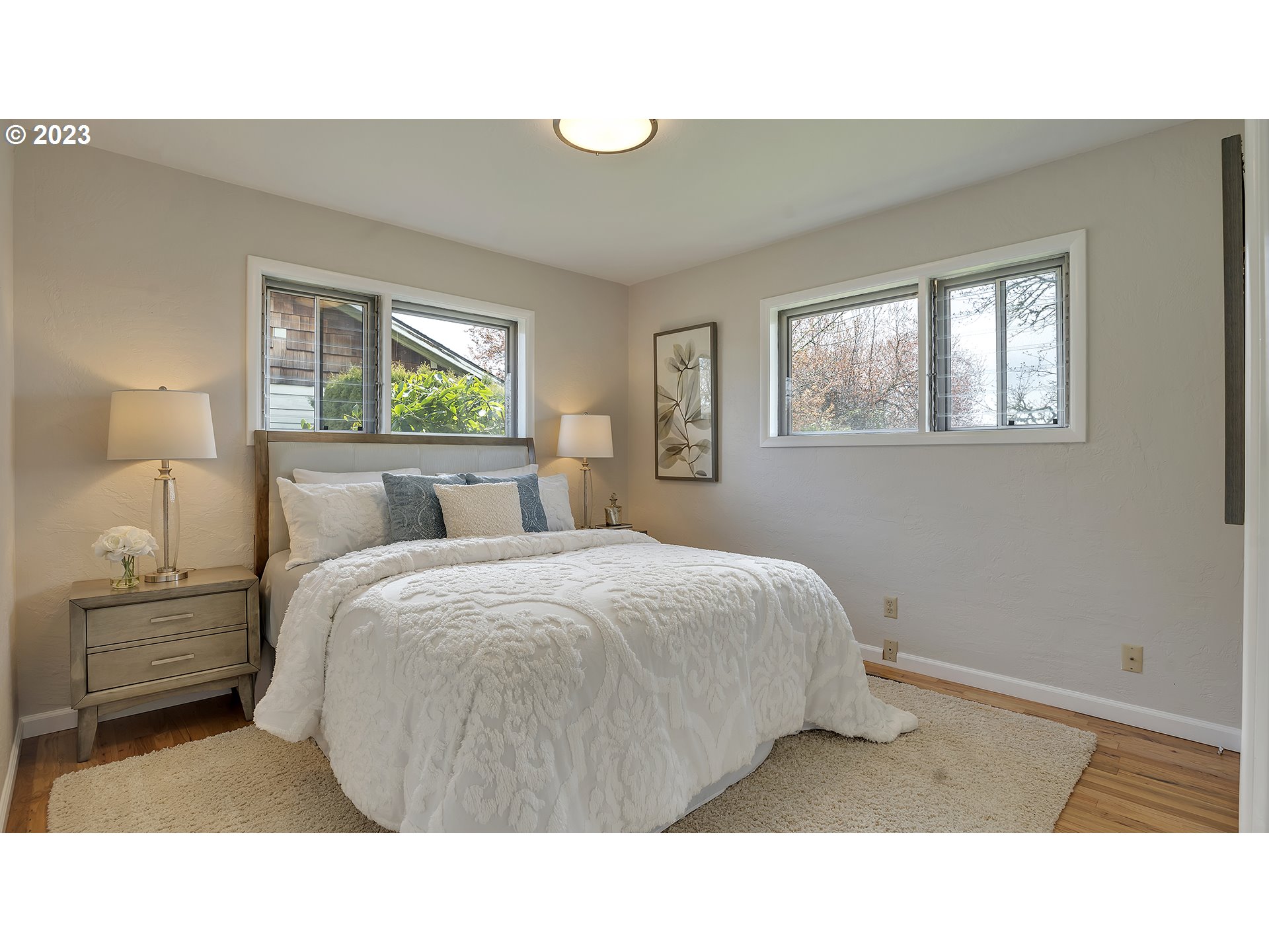 163 Northwest Reed Lane Dallas, OR 97338 - Photo 19 of 30 a bedroom with a bed and a night stand