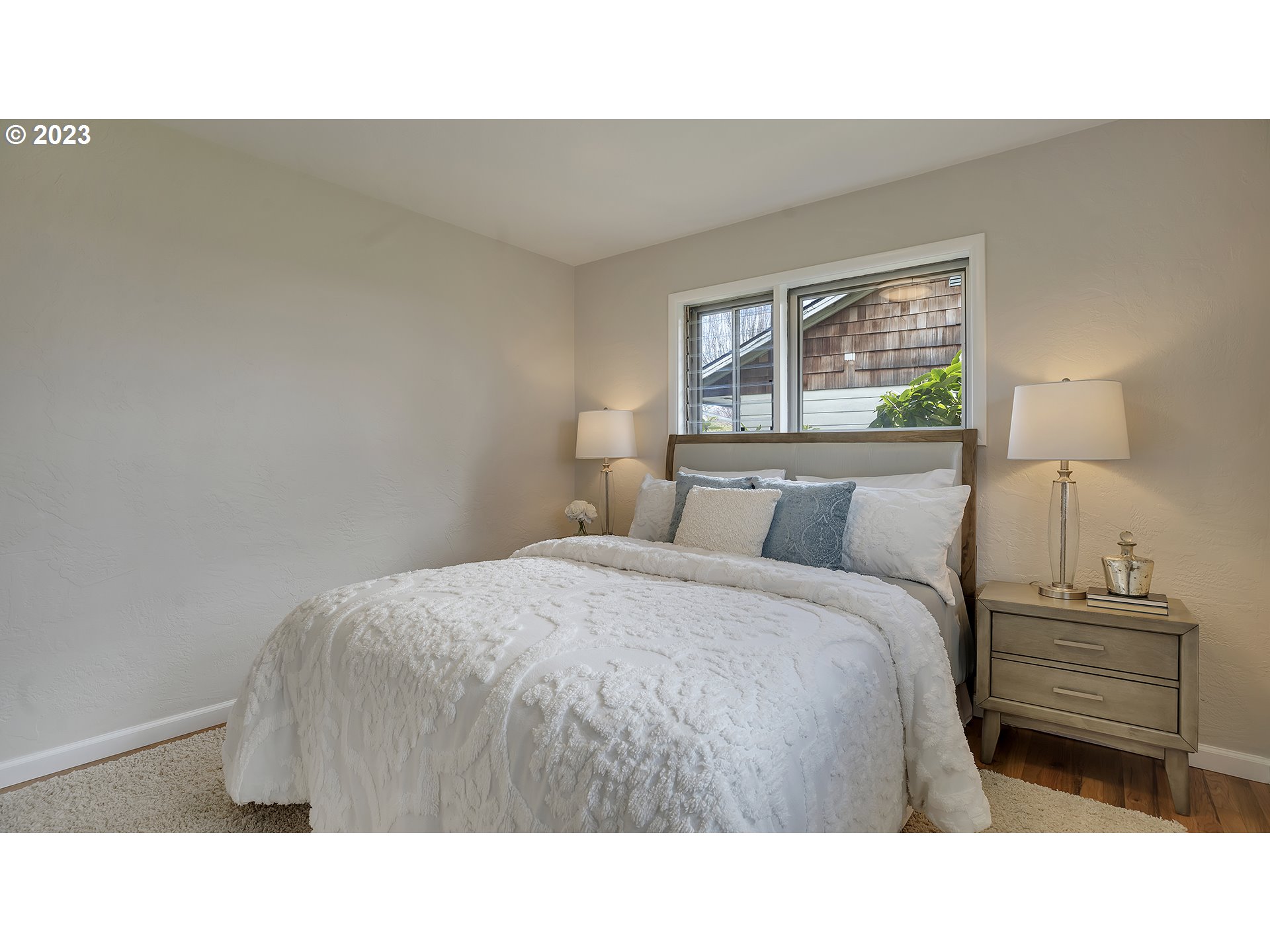163 Northwest Reed Lane Dallas, OR 97338 - Photo 20 of 30 a bedroom with a bed and a night stand