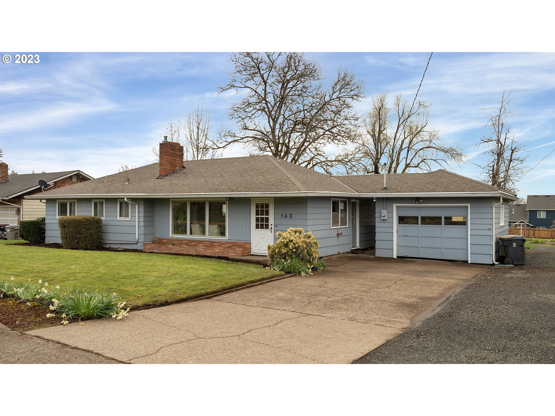 163 Northwest Reed Lane Dallas, OR 97338 - Photo 2 of 30 a house view with a garden space