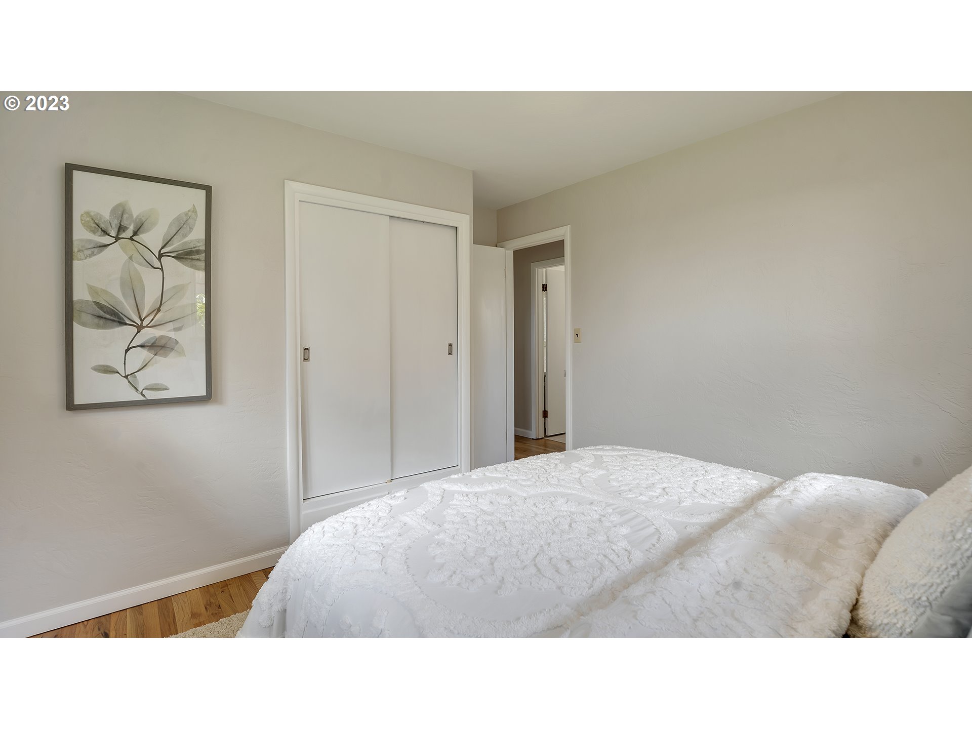 163 Northwest Reed Lane Dallas, OR 97338 - Photo 21 of 30 a bedroom with a bed and wall painting