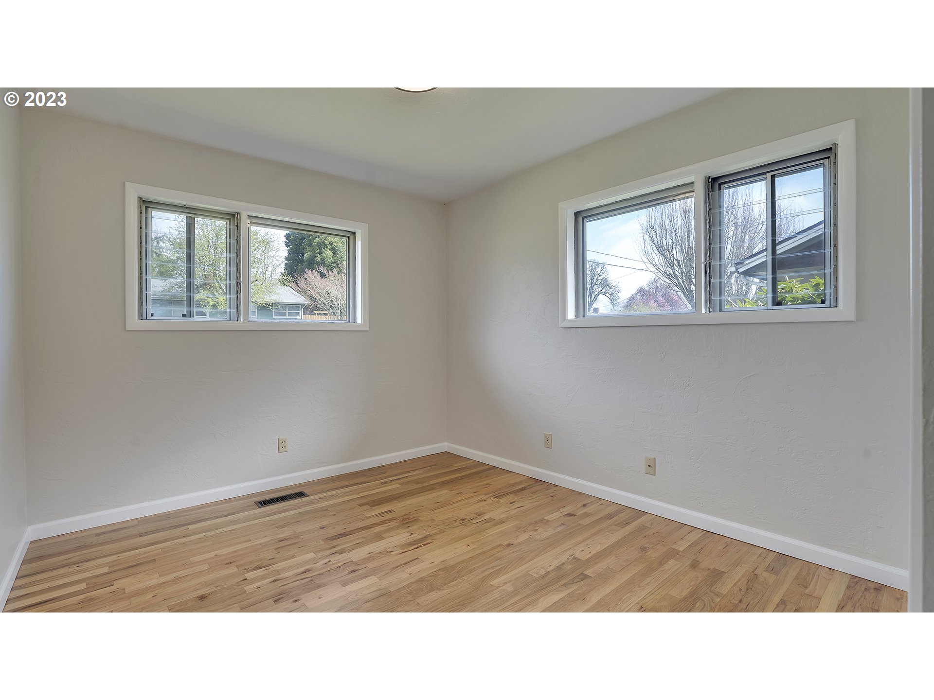 163 Northwest Reed Lane Dallas, OR 97338 - Photo 24 of 30 a room with a window and painting on the wall