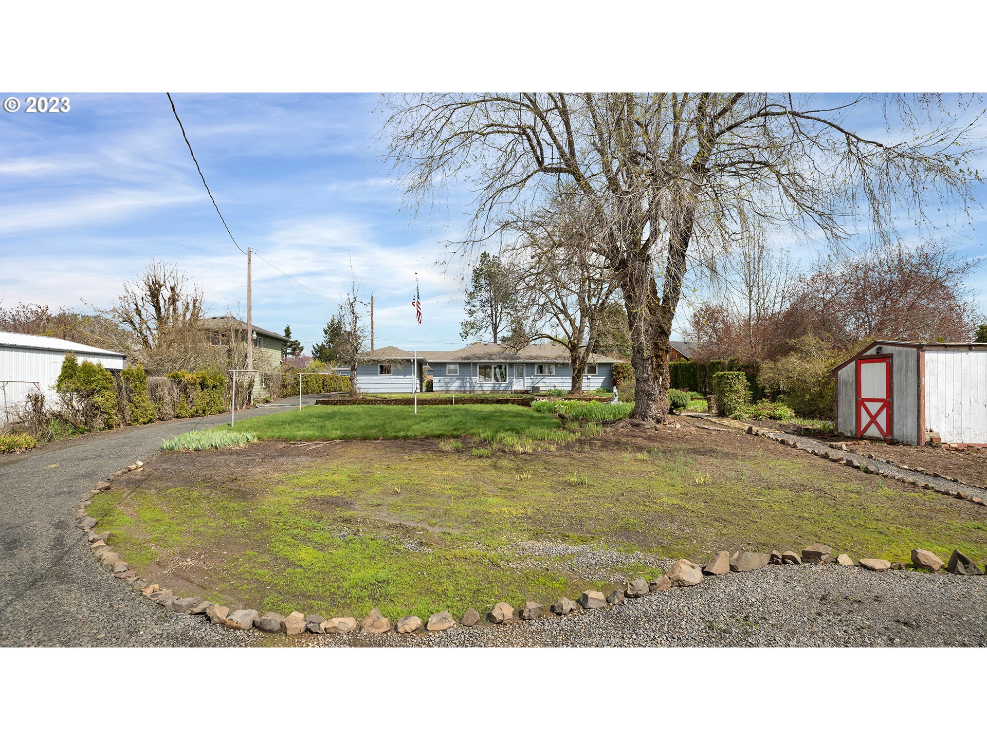 163 Northwest Reed Lane Dallas, OR 97338 - Photo 27 of 30 a view of a house with a yard