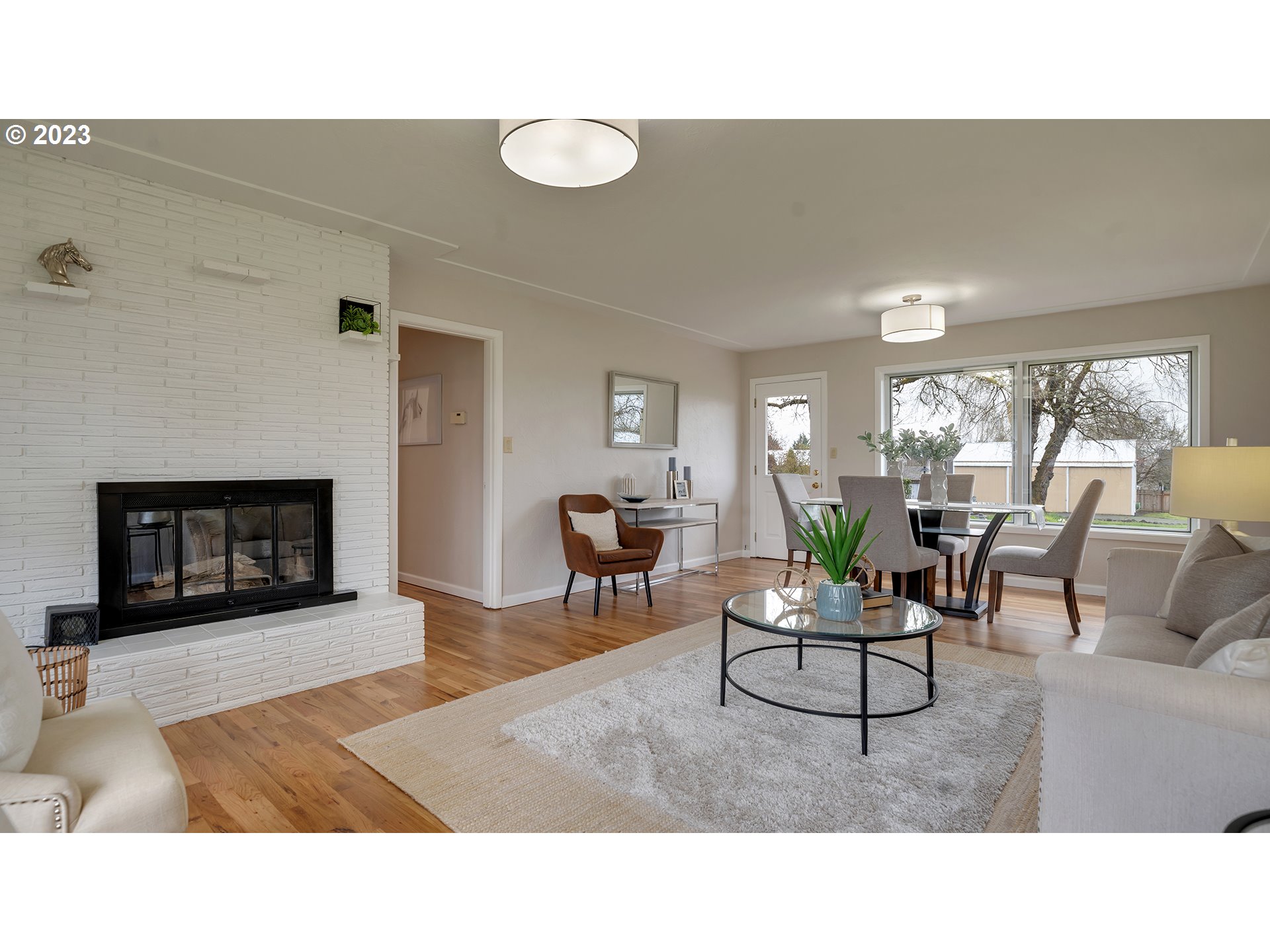 163 Northwest Reed Lane Dallas, OR 97338 - Photo 4 of 30 a living room with furniture and a fireplace