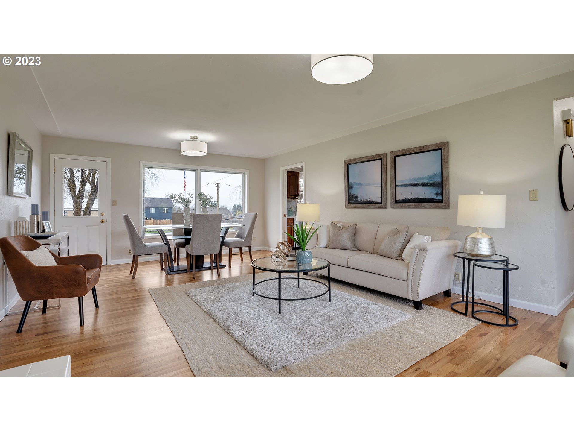 163 Northwest Reed Lane Dallas, OR 97338 - Photo 5 of 30 a living room with furniture and a large window