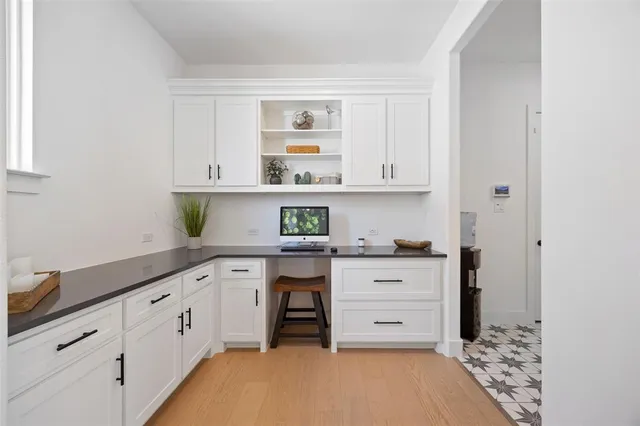 a kitchen with stainless steel appliances granite countertop a sink and cabinets