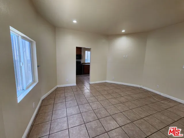 a kitchen with granite countertop a sink a stove and a microwave