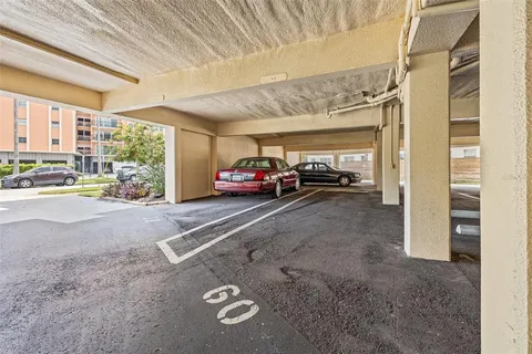 a view of a chairs and table in patio