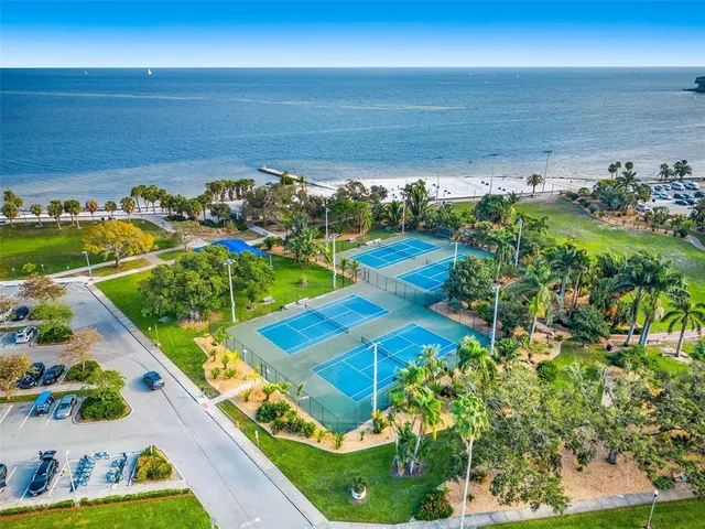 a view of a sign in front of flowers