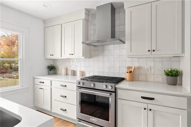 a bathroom with a sink mirror and vanity