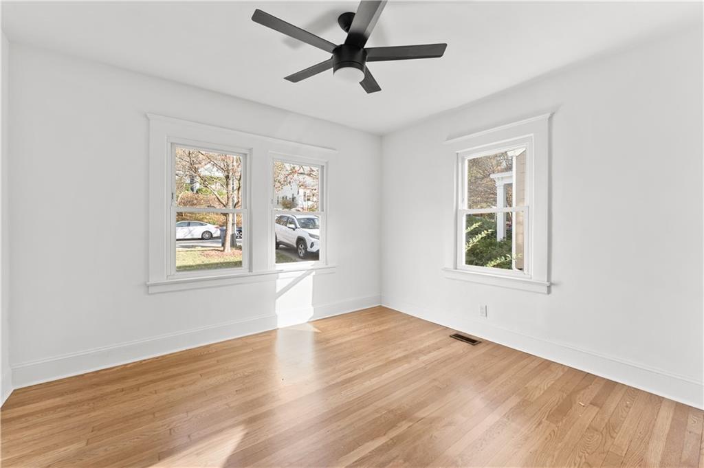 845 Ormewood Terrace Southeast, Unit A Atlanta, GA 30316 - Photo 15 of 34 wooden floor in an empty room with a window