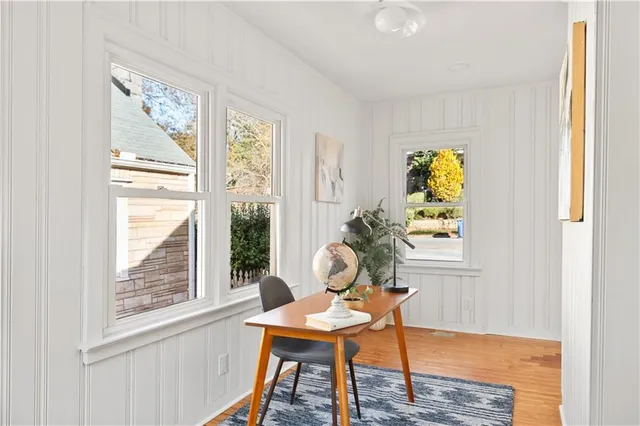 a living room with furniture and a potted plant