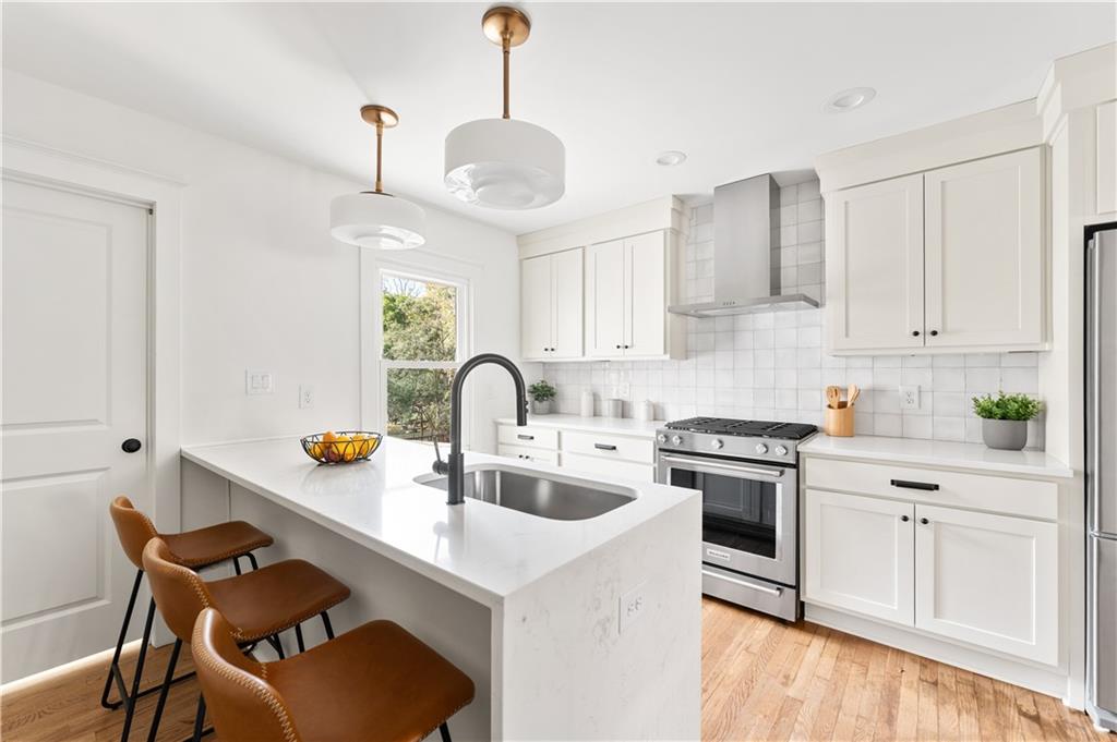 845 Ormewood Terrace Southeast, Unit A Atlanta, GA 30316 - Photo 2 of 34 a kitchen with stainless steel appliances granite countertop a sink a stove and a refrigerator