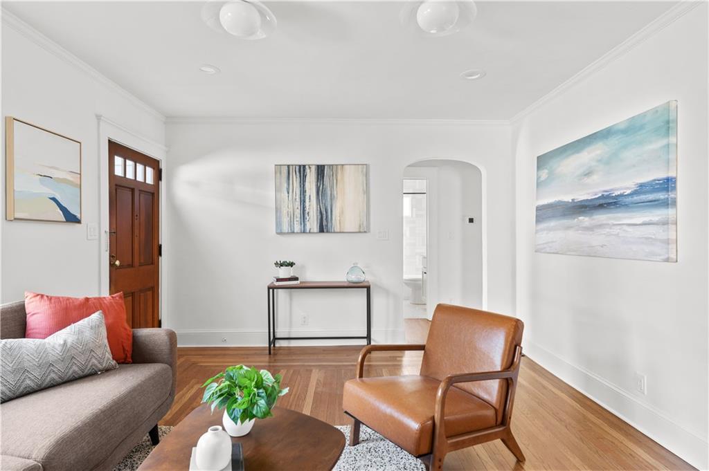 845 Ormewood Terrace Southeast, Unit A Atlanta, GA 30316 - Photo 21 of 34 a living room with furniture and a potted plant