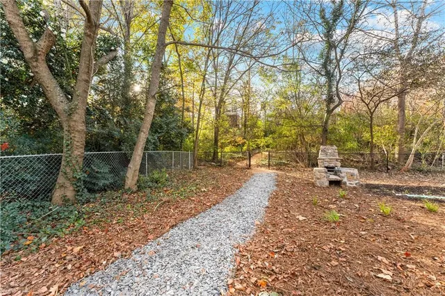 a view of a yard with wooden fence and floor