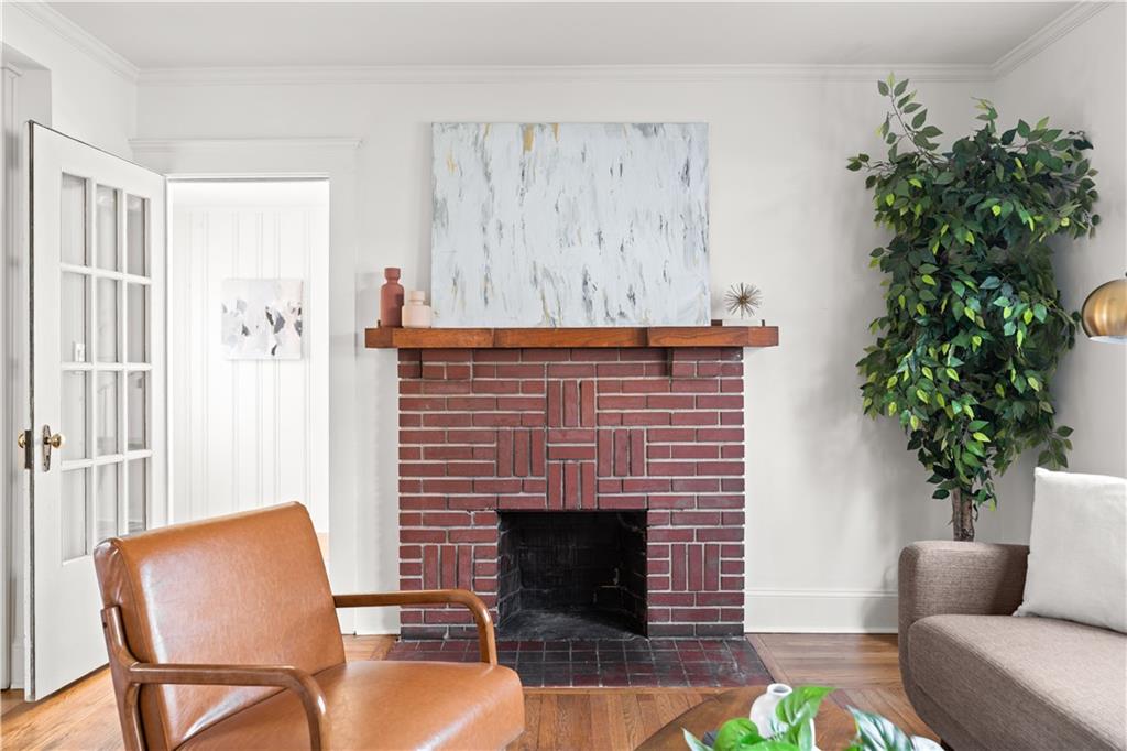 845 Ormewood Terrace Southeast, Unit A Atlanta, GA 30316 - Photo 5 of 34 a living room with furniture and a fireplace