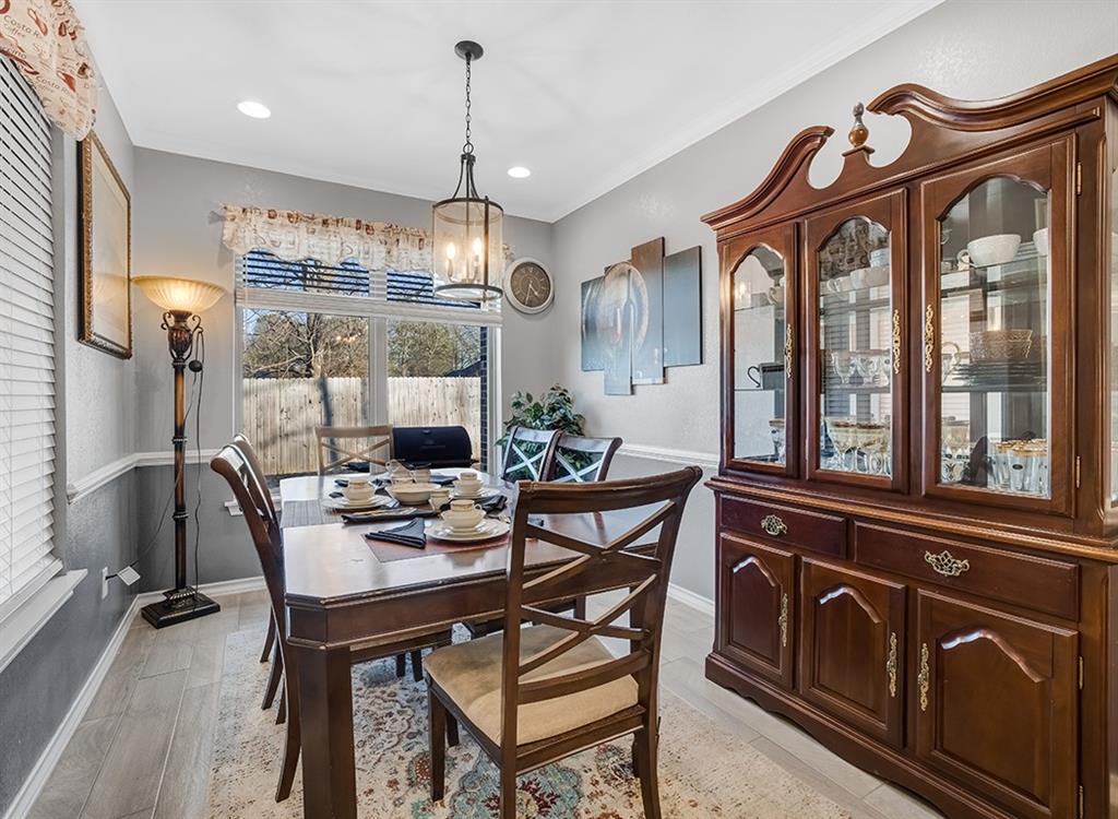 523 Mitchell Ryan Wake Village, TX 75501 - Photo 11 of 37 a view of a dining room with furniture window and wooden floor