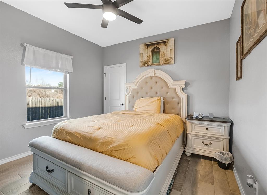 523 Mitchell Ryan Wake Village, TX 75501 - Photo 16 of 37 a bed sitting in a bedroom next to a window