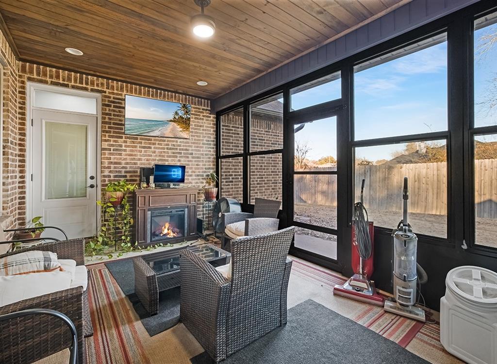 523 Mitchell Ryan Wake Village, TX 75501 - Photo 17 of 37 a living room with furniture and a floor to ceiling window