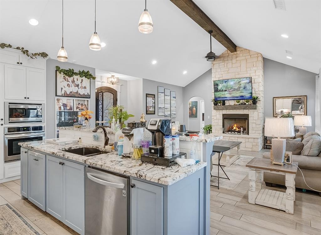 523 Mitchell Ryan Wake Village, TX 75501 - Photo 18 of 37 a kitchen with stainless steel appliances granite countertop a stove and cabinets