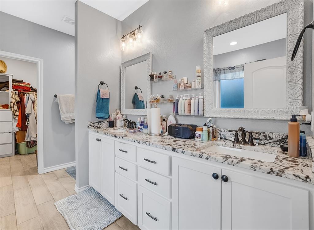 523 Mitchell Ryan Wake Village, TX 75501 - Photo 24 of 37 a bathroom with a sink and a mirror