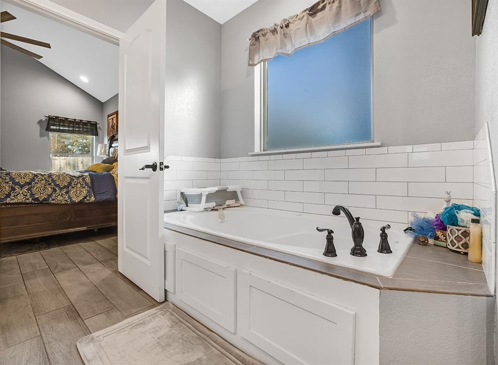 523 Mitchell Ryan Wake Village, TX 75501 - Photo 25 of 37 a bathroom with a sink and a mirror
