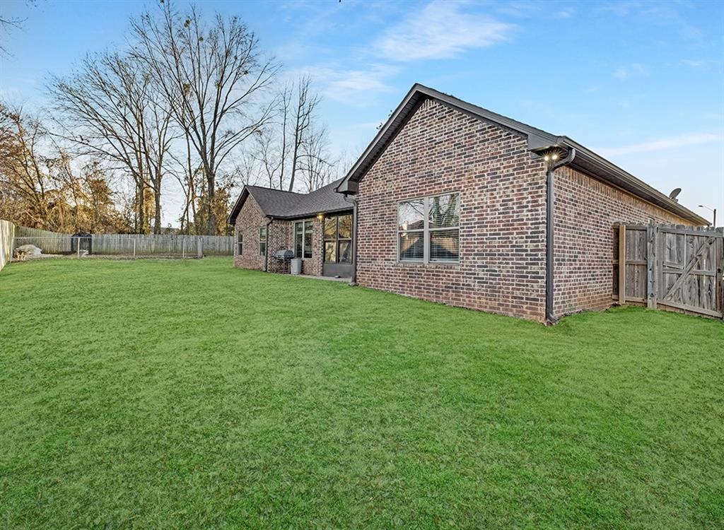 523 Mitchell Ryan Wake Village, TX 75501 - Photo 29 of 37 a view of a house with a yard