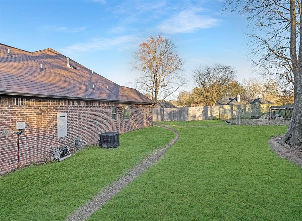 523 Mitchell Ryan Wake Village, TX 75501 - Photo 30 of 37 a front view of a house with garden
