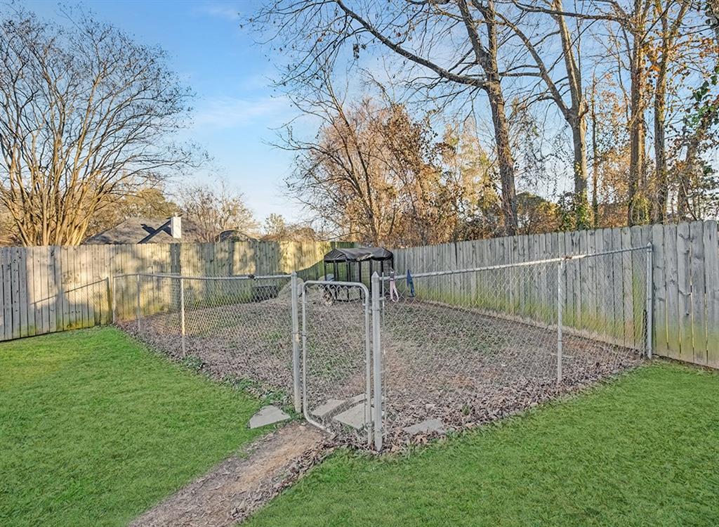 523 Mitchell Ryan Wake Village, TX 75501 - Photo 31 of 37 a view of a yard with a tiny play house