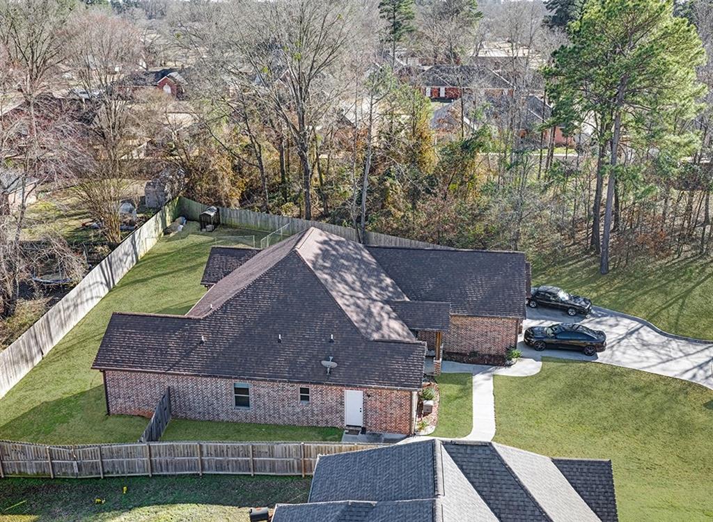 523 Mitchell Ryan Wake Village, TX 75501 - Photo 35 of 37 an aerial view of a house with a garden and plants