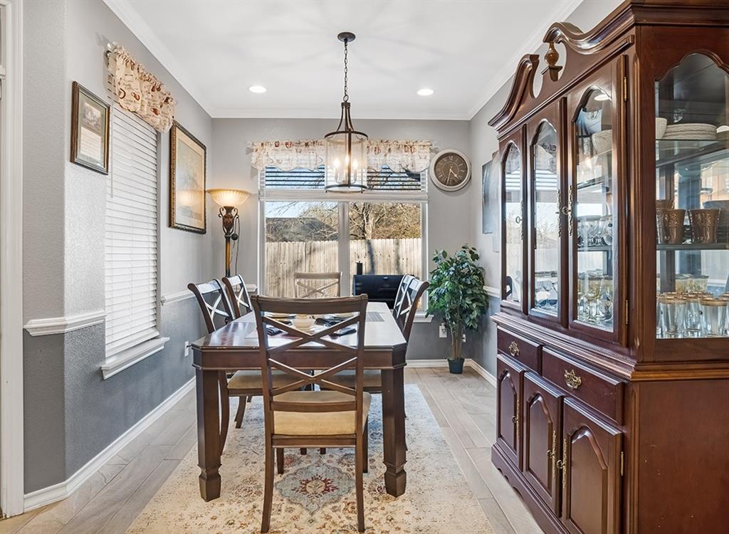523 Mitchell Ryan Wake Village, TX 75501 - Photo 7 of 37 a dining room with furniture a chandelier and wooden floor