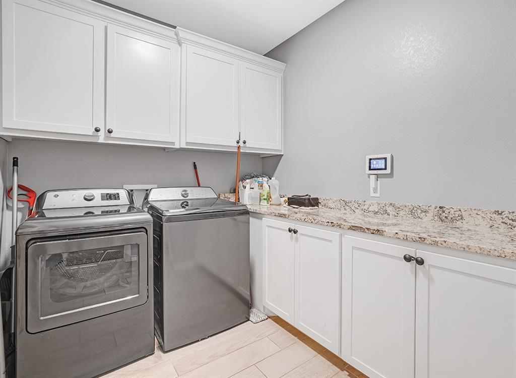 523 Mitchell Ryan Wake Village, TX 75501 - Photo 8 of 37 a utility room with dryer and washer